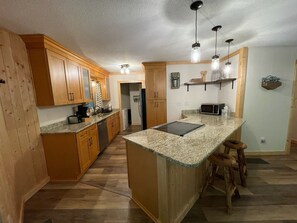 Newly renovated kitchen includes all necessary appliances an utensils.