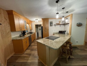 Newly renovated kitchen includes all necessary appliances an utensils.