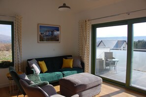 Sitting areas with double aspect windows framing the view