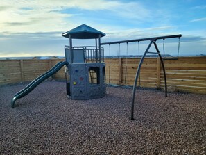 Playground, under is gravel. Use at your own risk.