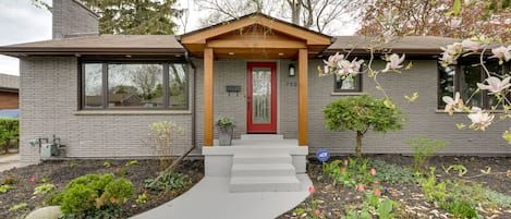 Exterior of the home featuring beautiful pathway landscaping.