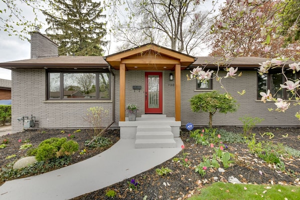 Exterior of the home featuring beautiful pathway landscaping.