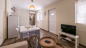 The living area comes with all you could require during your stay, including an AC!