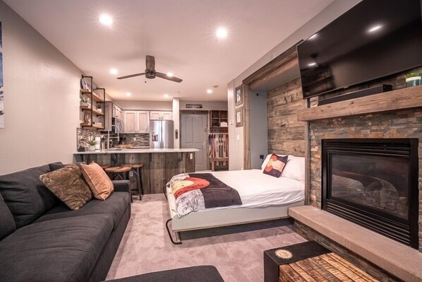 Fireplace, Indoors, Couch, Furniture, Ceiling Fan