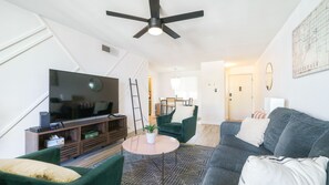 Living Room with a comfortable couch and a smart tv! 