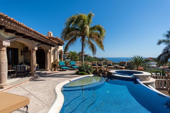 Daytime view of the pool and patio of Villa Maria.