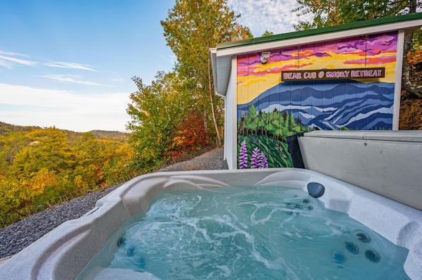 Private outdoor hot tub with gorgeous mountain view and Smoky Mountain mural.
