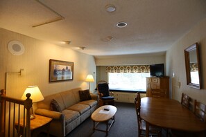 Living Room with Dining Table and TV with DVD player in Condo at Waterville Valley