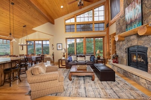 Main level living room with gas fireplace.