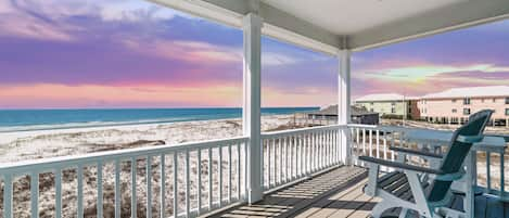 Unwind and rejuvenate in the tranquil master suite on the private balcony with breathtaking panoramic ocean views, overlooking the pristine white sand beaches of Gulf Shores