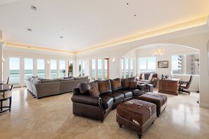 Great leather sofa and ottomans useful for watching TV!