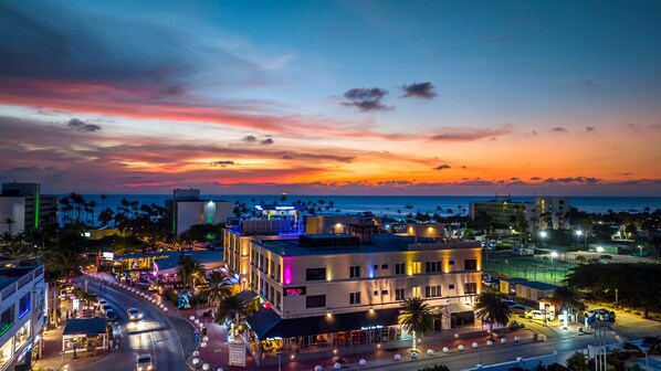 Witness nature's beauty unfold with sunset ocean views from our luxurious condo. - Indulge in breathtaking views of the sunset over the ocean from our living room. - Elevate your stay with unforgettable sunset vistas from our beachfront condo.