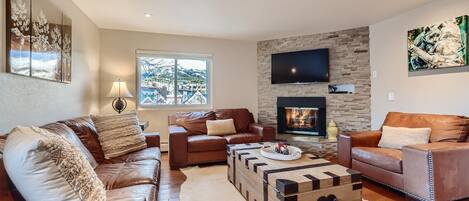 Open living space with fire place, and TV