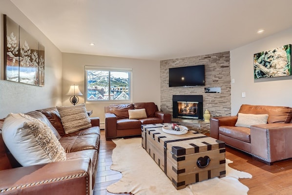 Open living space with fire place, and TV