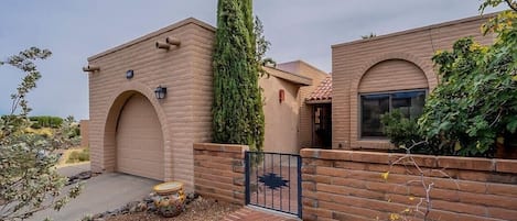 Front of house including one car garage on the left