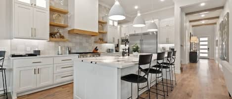 The Madison's fully-equipped kitchen features GE Cafe appliances and gas cooktop