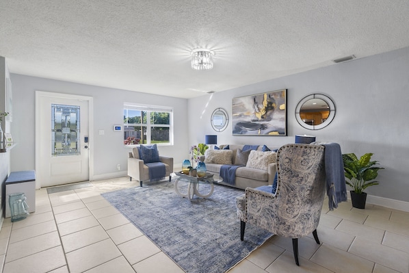Whether it's a movie night with loved ones or simply lounging and enjoying each other's company, our palm-themed living area is the perfect gathering spot for quality time and making cherished memories.