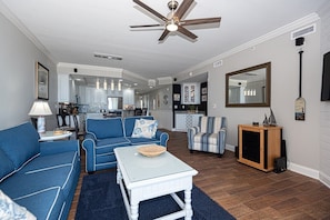 Spacious living room, dining area, and kitchen
