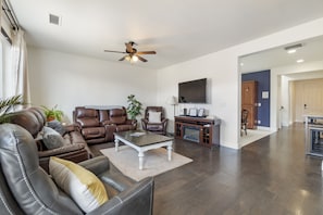 reclining leather with flat screen smart TV.