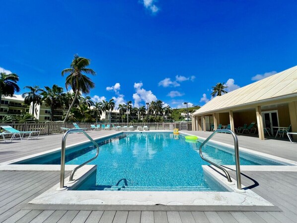 The Anchorage pool, with attached gym and sun loungers, beachfront!