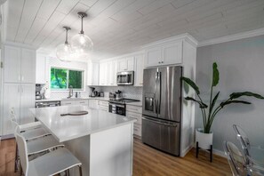 The beautiful and well-appointed kitchen. with full AC, and 4 bar stools!