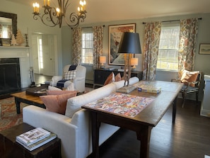 Sitting room w/fireplace, wet bar & puzzle table