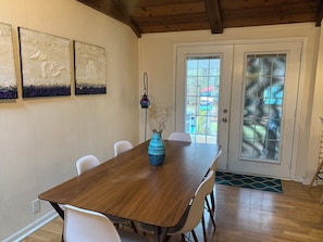Dining table seats six. French doors open to the patio.