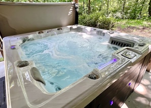 Hot tub with colorful night lights to soak in after your adventures