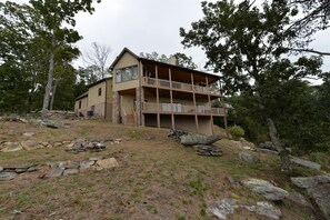 View of the back of the house.  The entrance is via the glass sliding door.