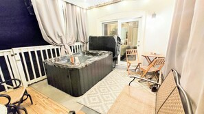 Relax in the hot tub just outside the master bedroom. Privacy curtains.