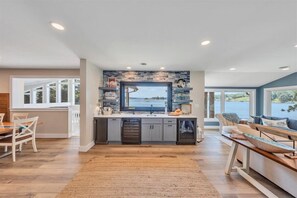 Entry foyer with wet bar and ice maker
