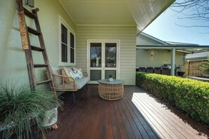 The front porch offers seating for your to enjoy your morning cuppa, breathing in that crisp country air.