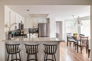 Kitchen with barstool and eat in nook