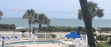 Balcony view of the waves over our sparkling pool 