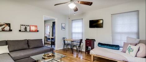 Living room with pull out queen sofa bed and twin futon.