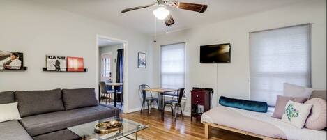 Living room with pull out queen sofa bed and twin futon. 