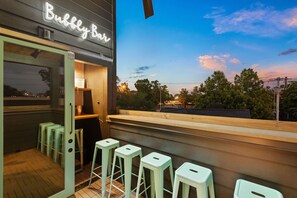 Pop a bottle of Bubbly and enjoy the skyline views from the third floor "Bubbly Bar"