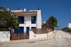 External view of the building. Our beach house, at the end of the road the sea