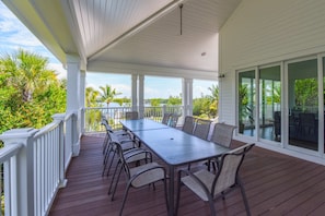 Outdoor Dining with Views of the Pool and Bay