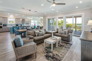 Open Concept Living Space Overlooking the Pool and Bay
