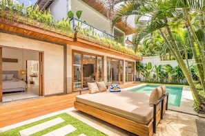 Sunbathe from the comforts of the lounge surrounded by tropical greenery