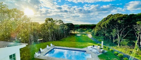 From the back deck: exquisite sunset views overlooking the pool and Southampton golf course.
