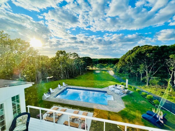 From the back deck: exquisite sunset views overlooking the pool and Southampton golf course.