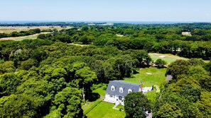 High above the estate you can see all four of Southampton's top golf courses and the Peconic Bay