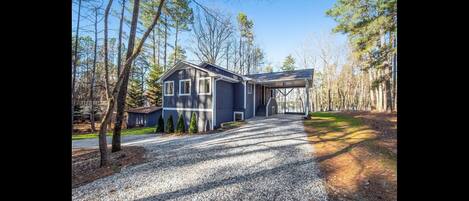 Covered carport in circular driveway...great for large vehicles and trailers