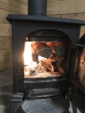 The woodstove located in the main floor is a lovely way to enjoy a glass of wine