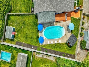 Bird's Eye view of the backyard. The property is the one with the Large Pool