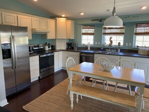 Modern, fully stocked kitchen.