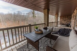 Seating on deck with view of the lake. 