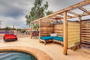 An outdoor shower, bar, and sitting area are available for your enjoyment.